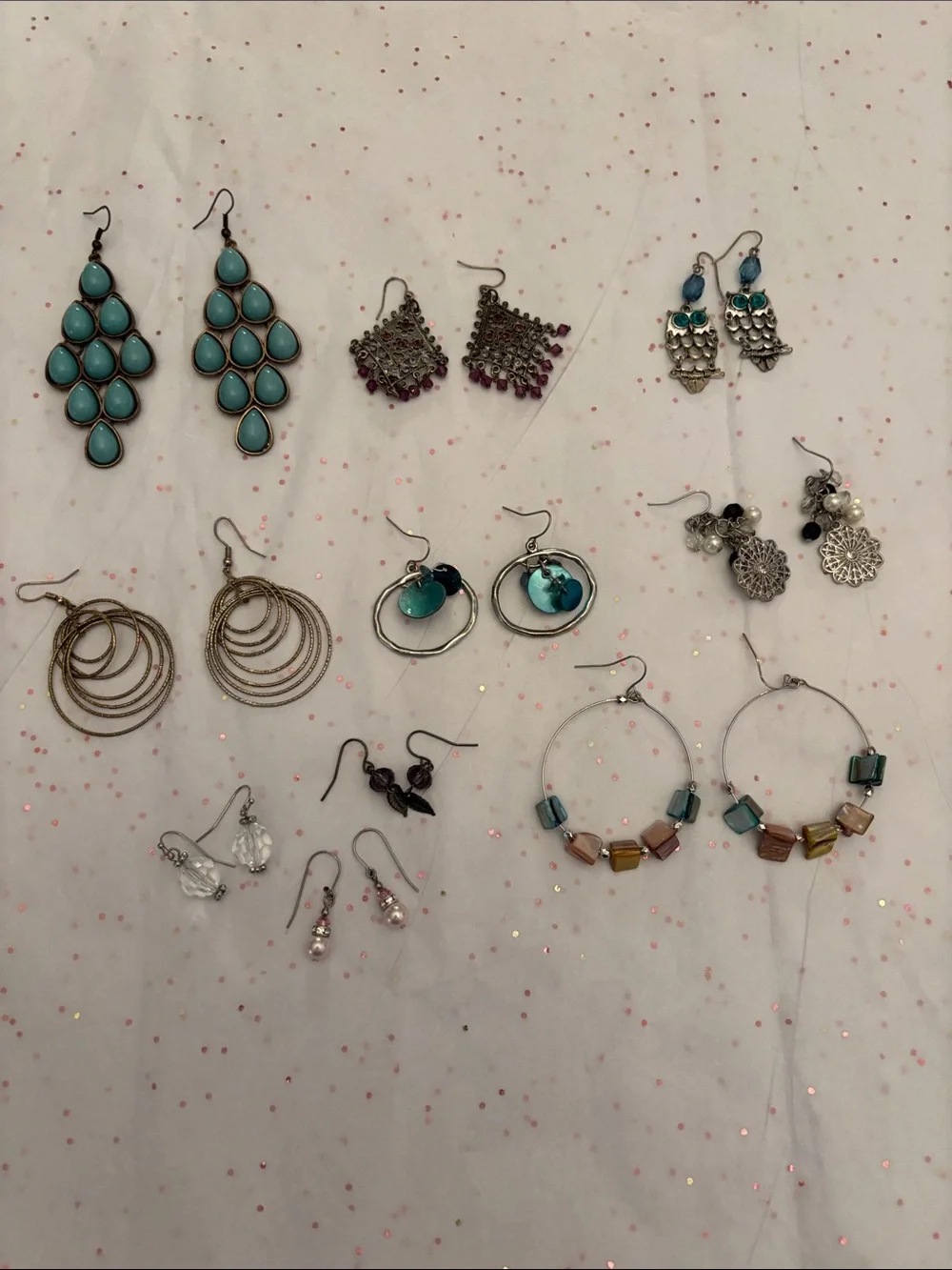 10 pair of assorted‎ earrings.